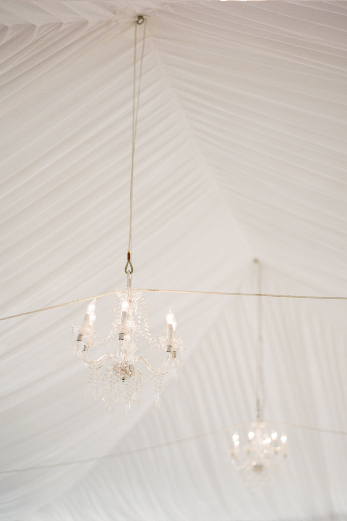 Two chandeliers hanging from a large white ceiling at the Sea Oats Estate in Captiva Island, FL